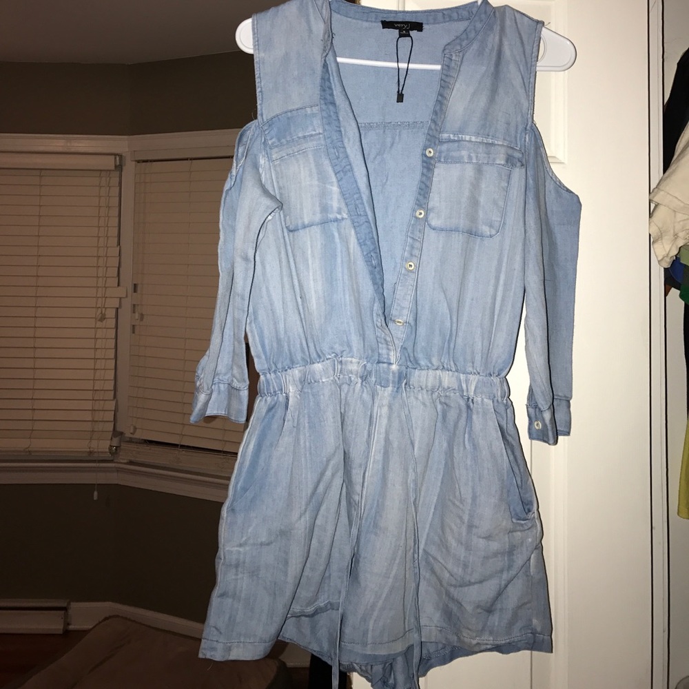 Boutique brand. Cold shoulder chambray romper.