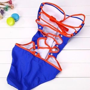 Blue sexy one piece with retro orange cross back s