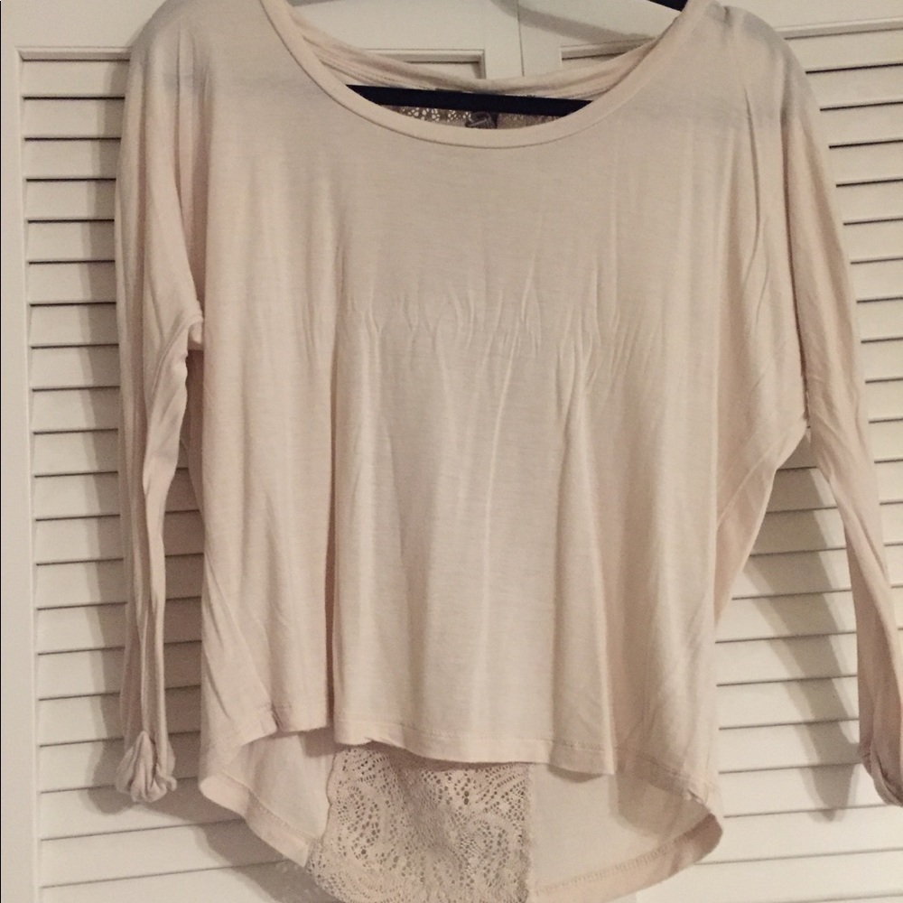 tan long sleeve with design on back