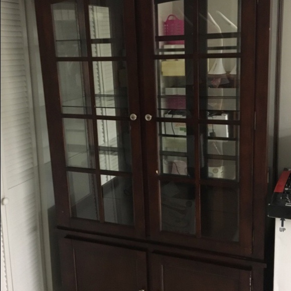 Brown curio wooden cabinet