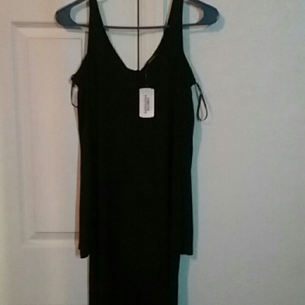 Sleek black party dress never worn with tags