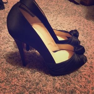 Black satin Christian Louboutin peep-toe pumps