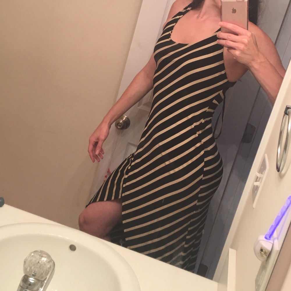 Bebe backless dress. NEVER WORN OUT OF MY HOUSE.