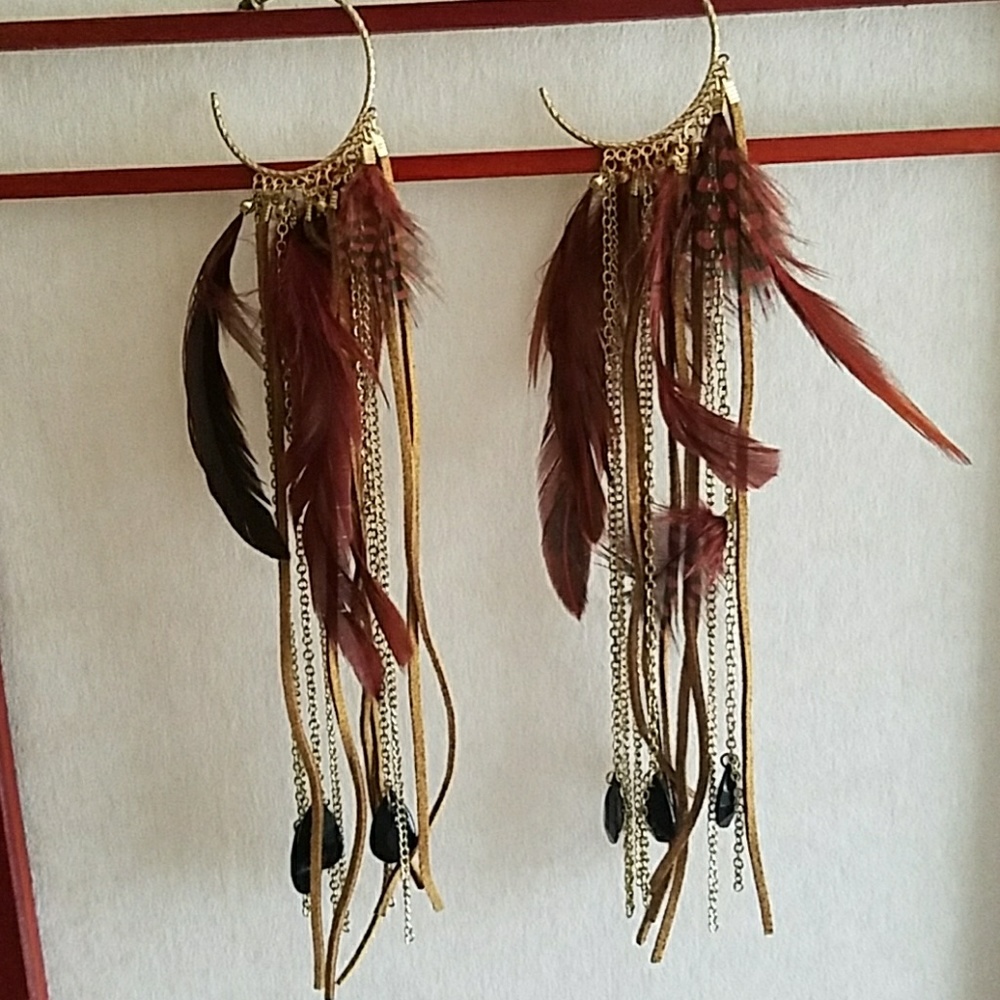 One-of-a-kind feather, suede and crystal earrings.