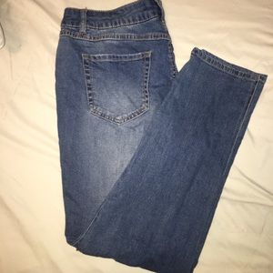 Light wash skinny jeans, partially ripped jeans