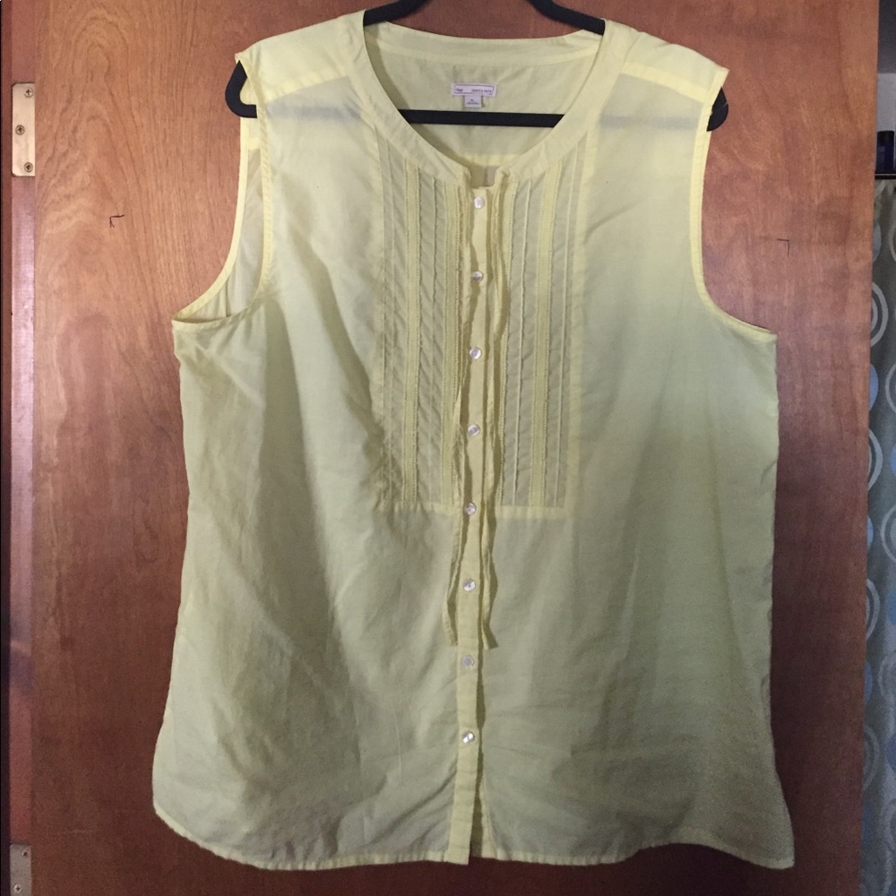 Yellow button down sleeveless blouse