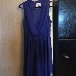 Blue dress with gold detailing.