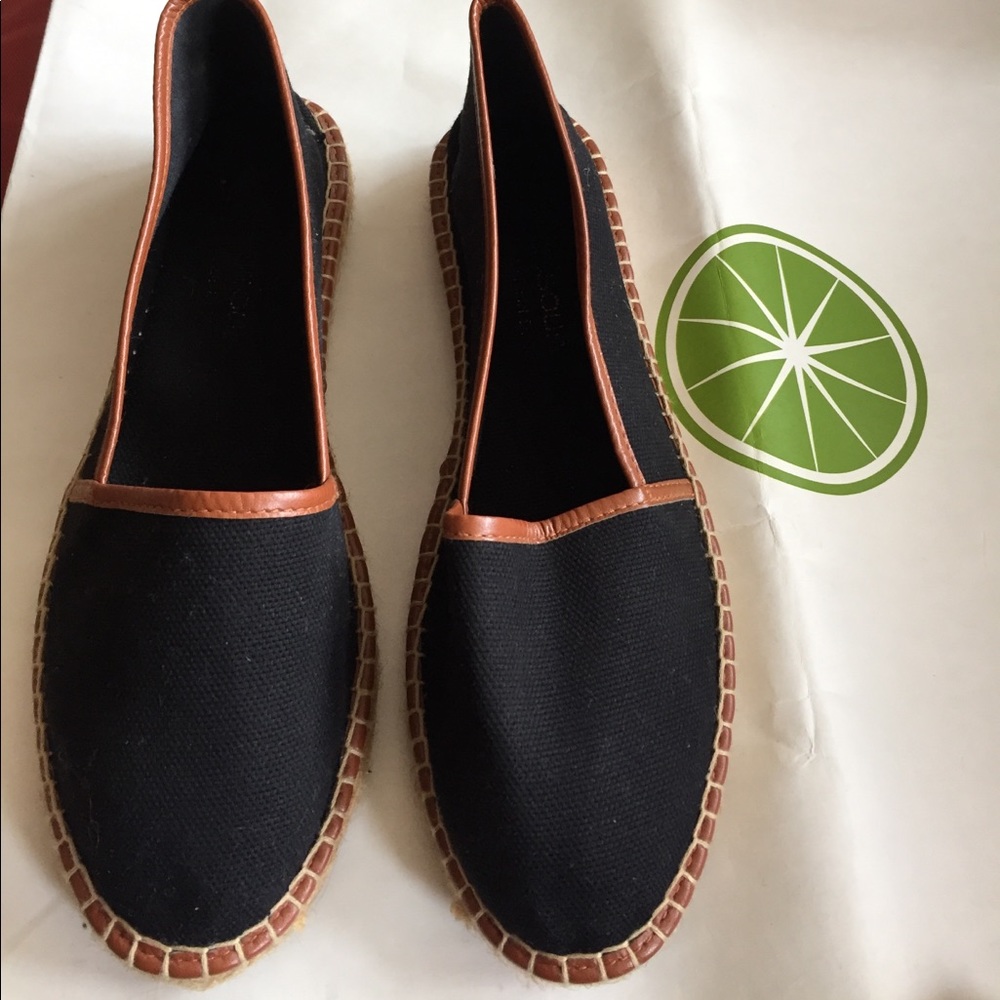 Black and brown leather slip ons