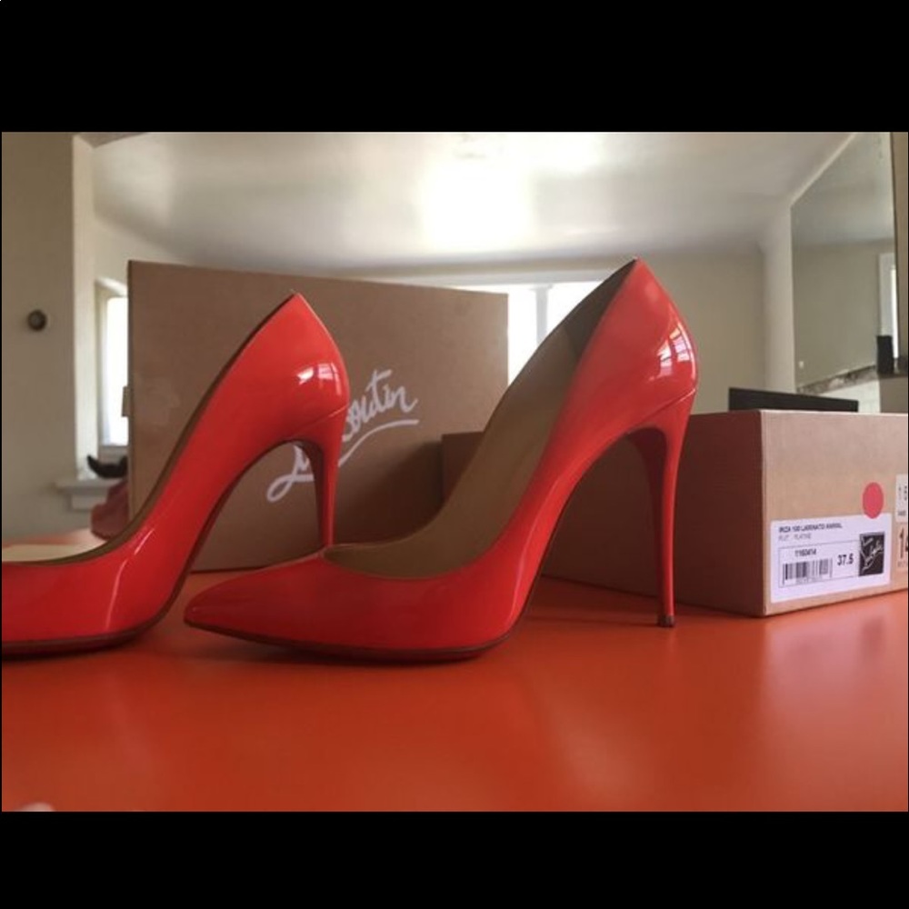 38/ 7.5 or 8 orange Christian Louboutin