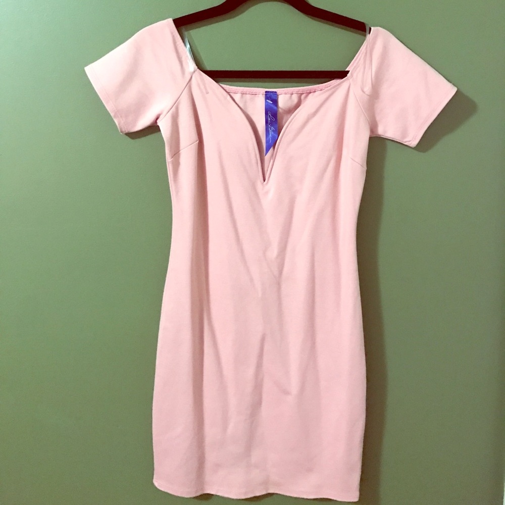 Powder pink tight mini dress.