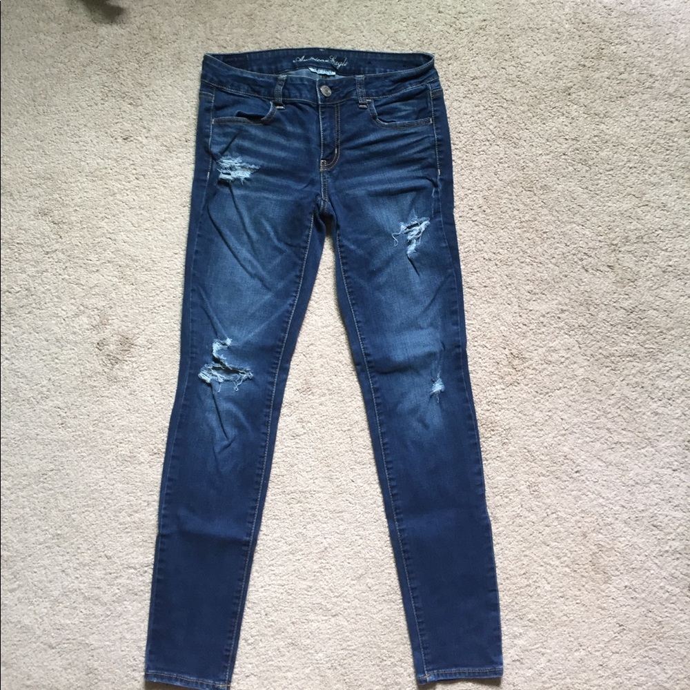 Lightly distressed dark wash jeans