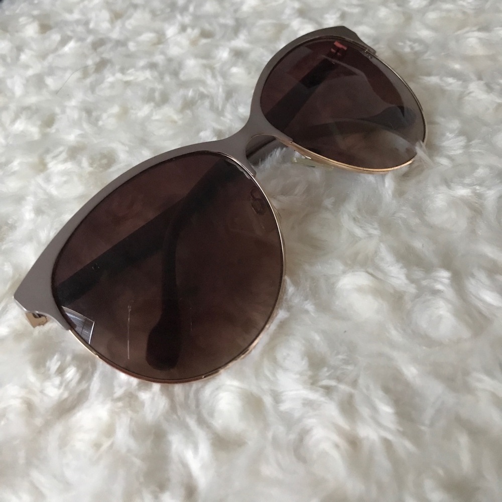 beige framed kitty style sunglasses