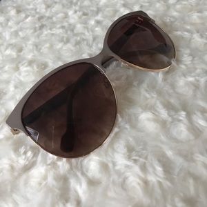 beige framed kitty style sunglasses