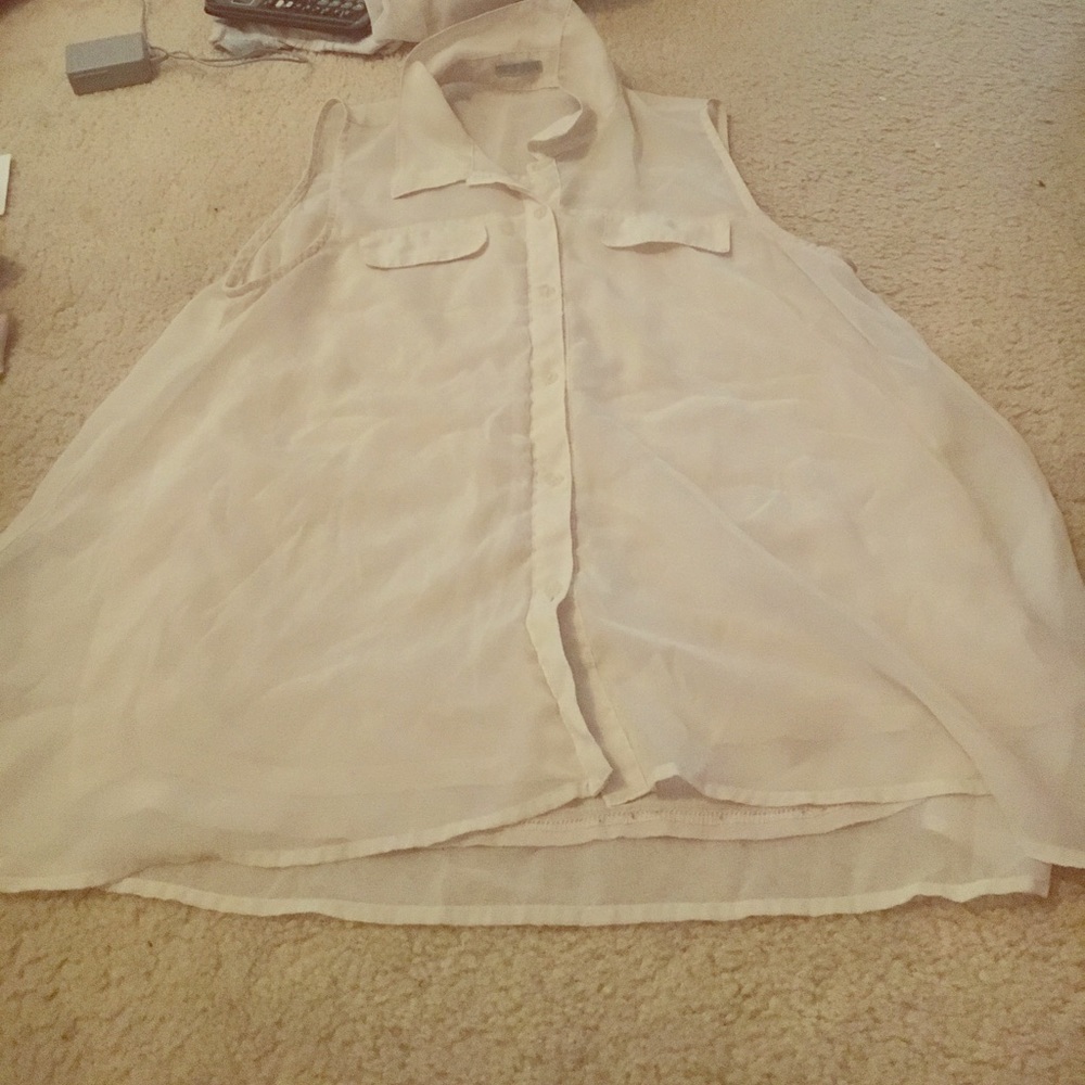 White sleeveless button up blouse