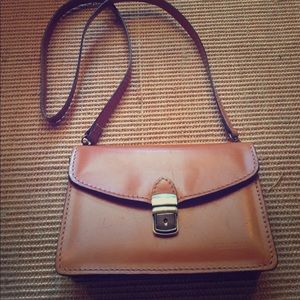 Real leather cross body bag in saddle
