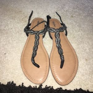 Black thong sandals.