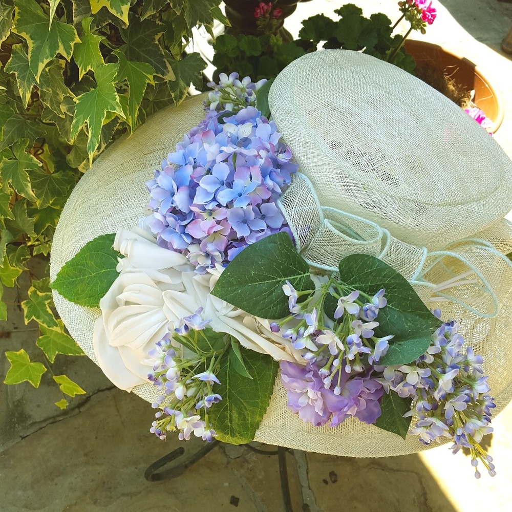 Smashing summer hat with blue and purple flowers