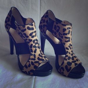 Leather and cheetah platform Calvin Klein sandals.