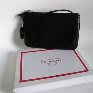 Coach pochette wristlet.