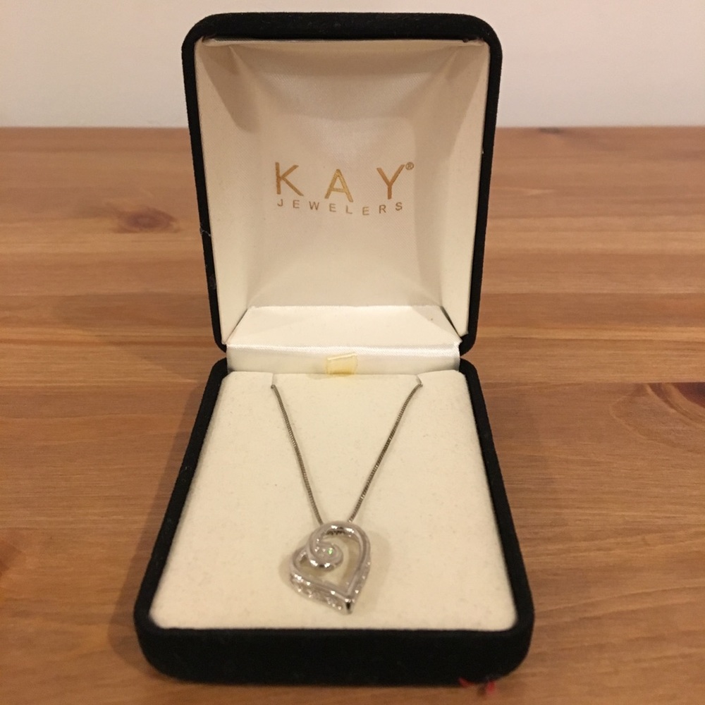 Heart shaped necklace with small diamond