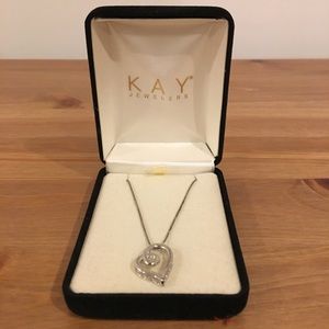 Heart shaped necklace with small diamond