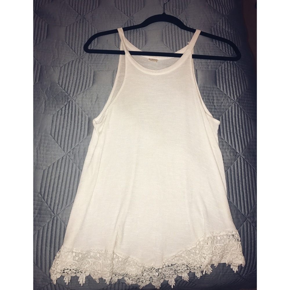 Loose fit beige top with cute bottom design