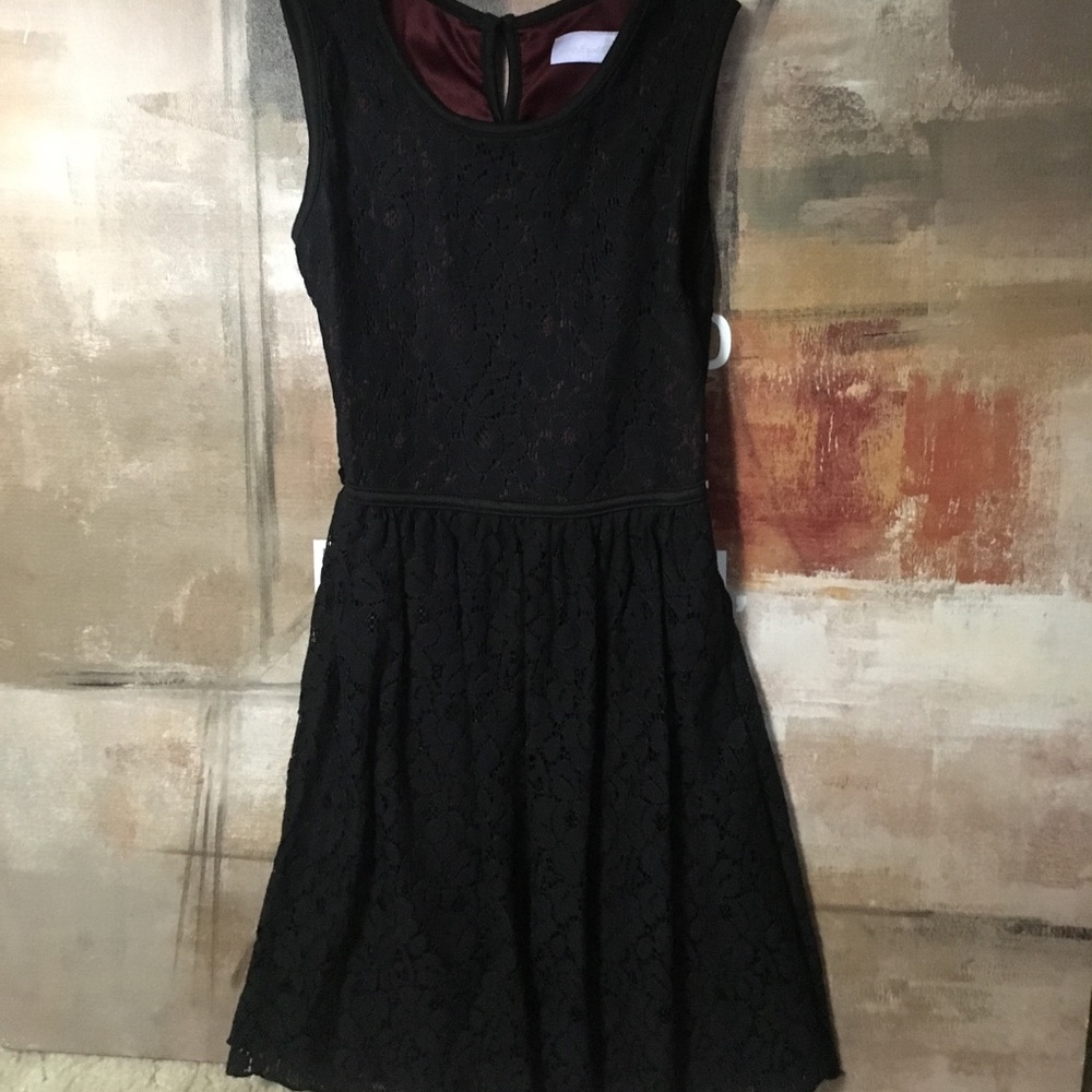 A young girls lace black dress