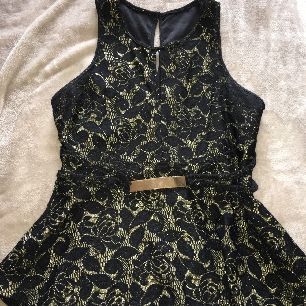 Black and gold peplum top