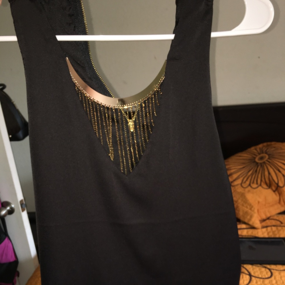 Black top with gold neck collar