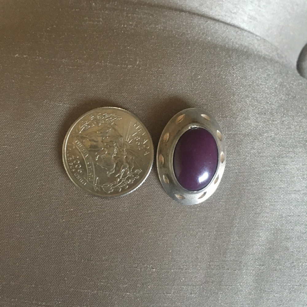 Sterling Silver earrings with a purple stone.
