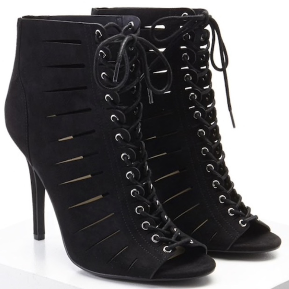 Caged laced up stilettos.  Black heels sz