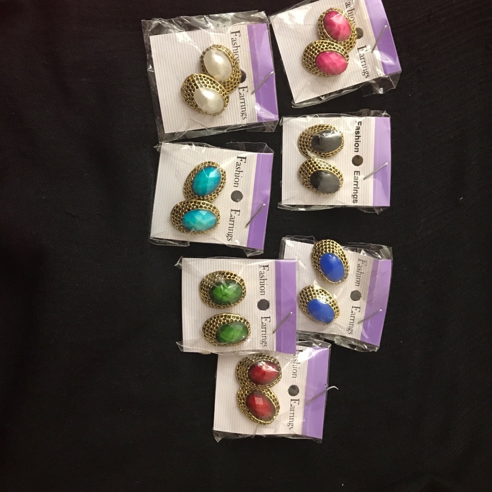 Stone and gold earring Pairs. Seven available