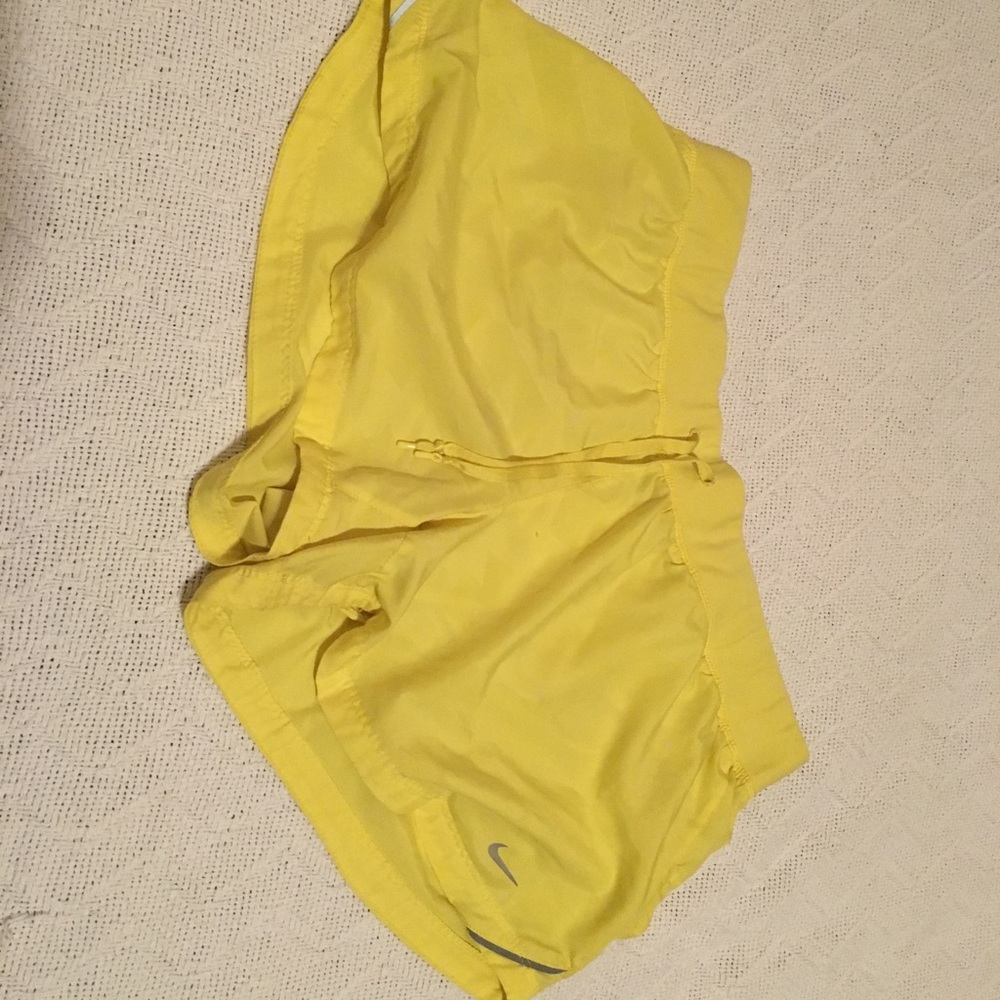 Yellow Nike running shorts