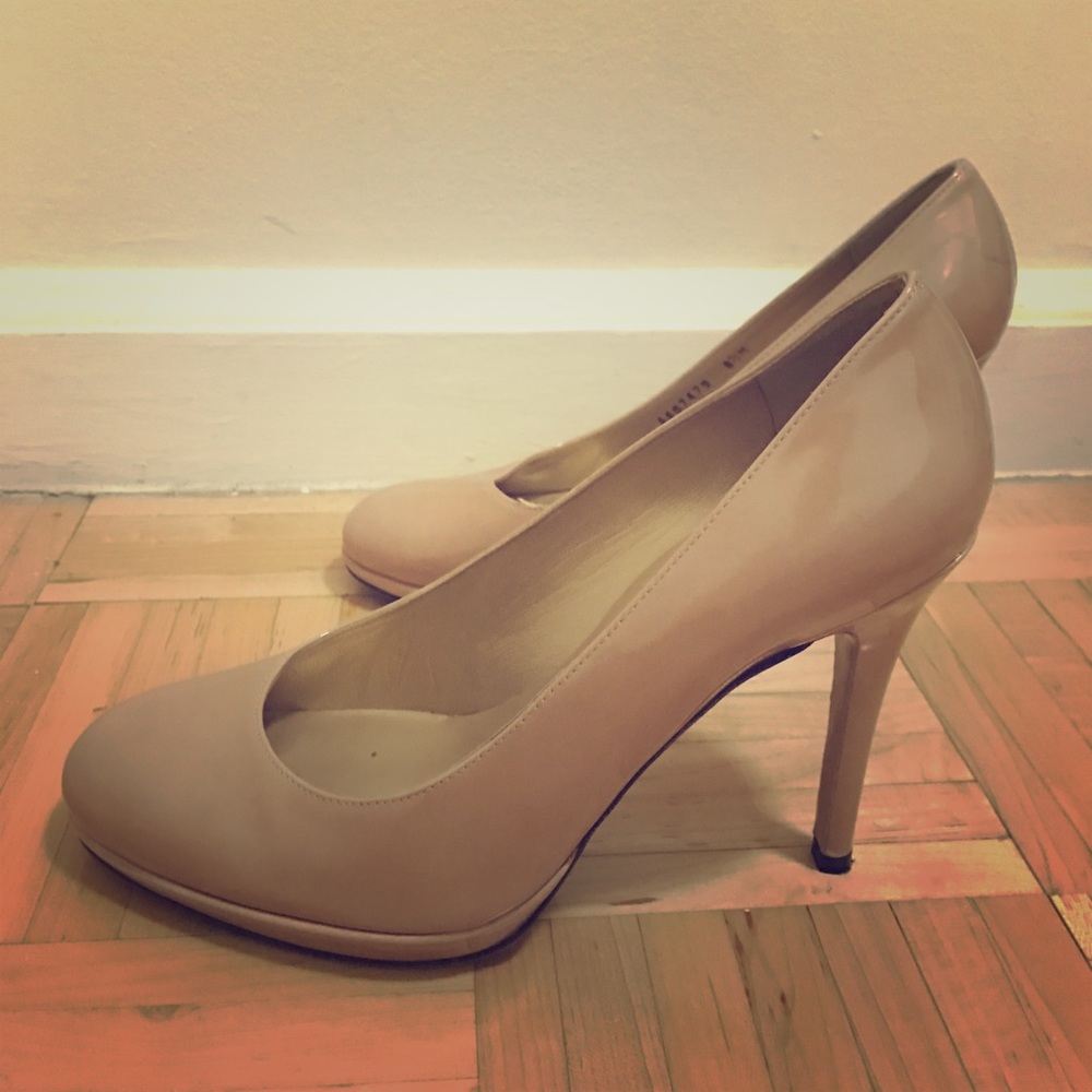 Stuart Weitzman cream/nude pumps.