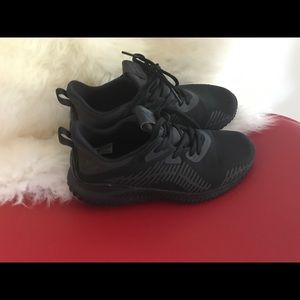 Black Adidas running shoes