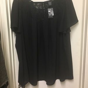 Torrid sheer and lace black top.