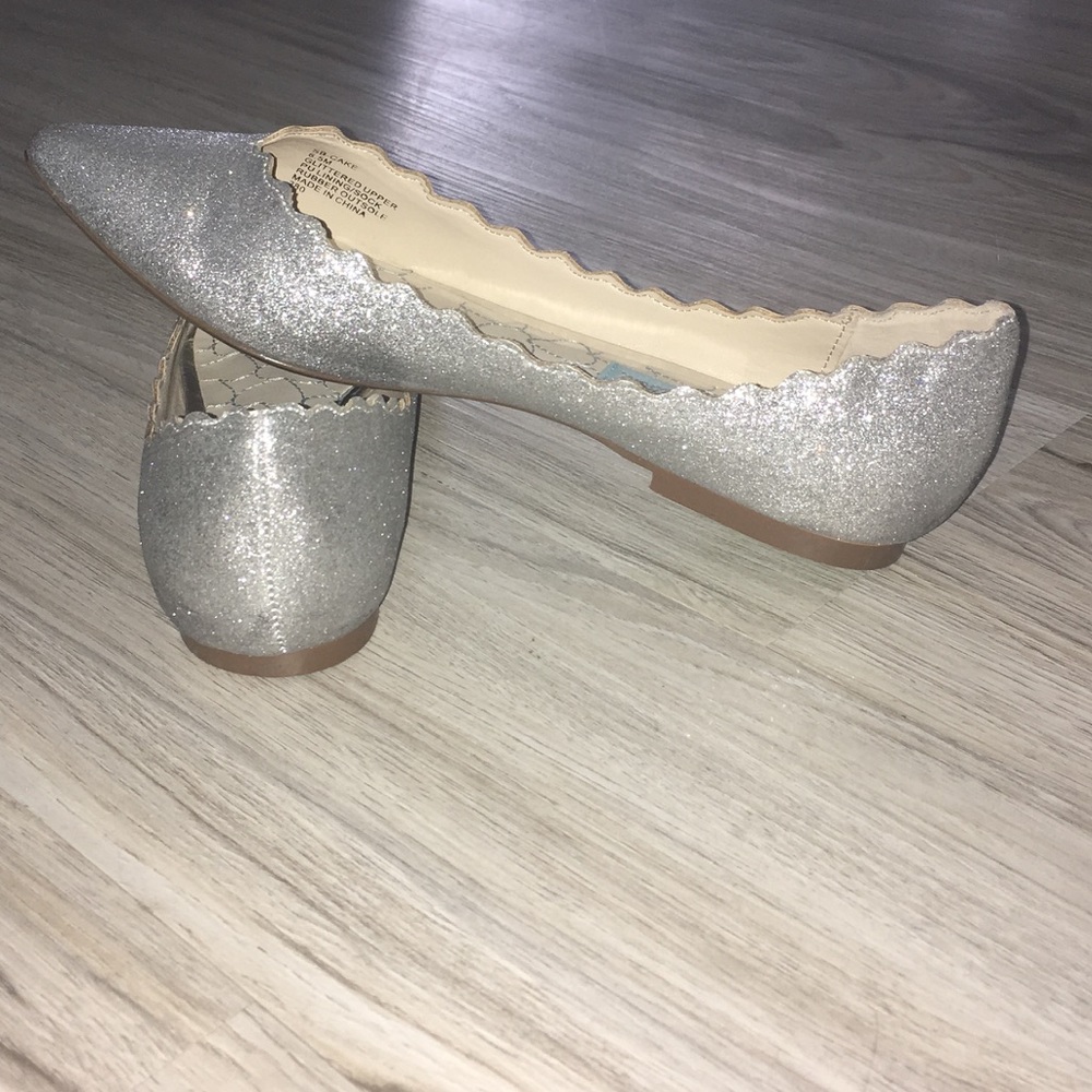 Betsey Johnson silver flat with scalloped edge