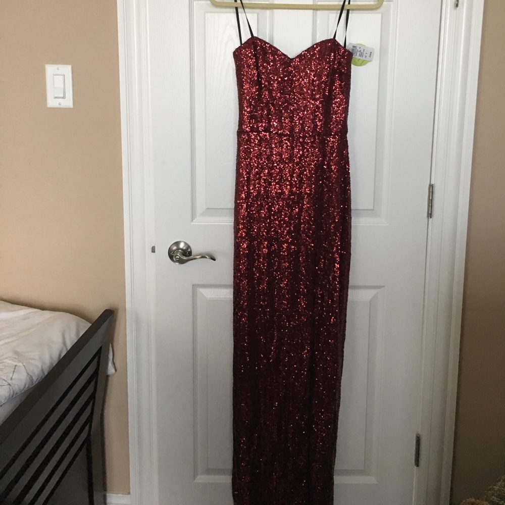Long red sequence evening gown with high slit