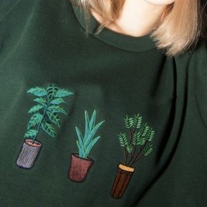 green potted plant sweater