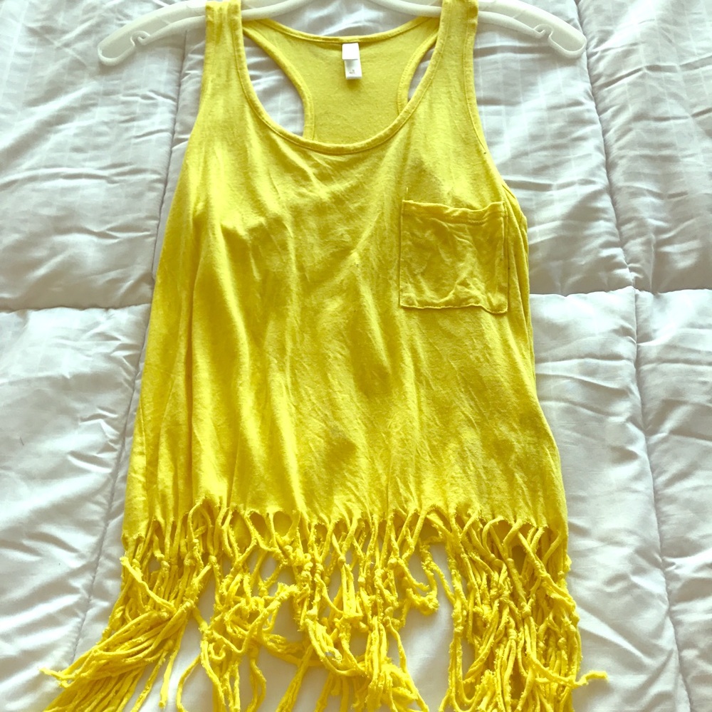 Yellow tank top. Fringe ends.