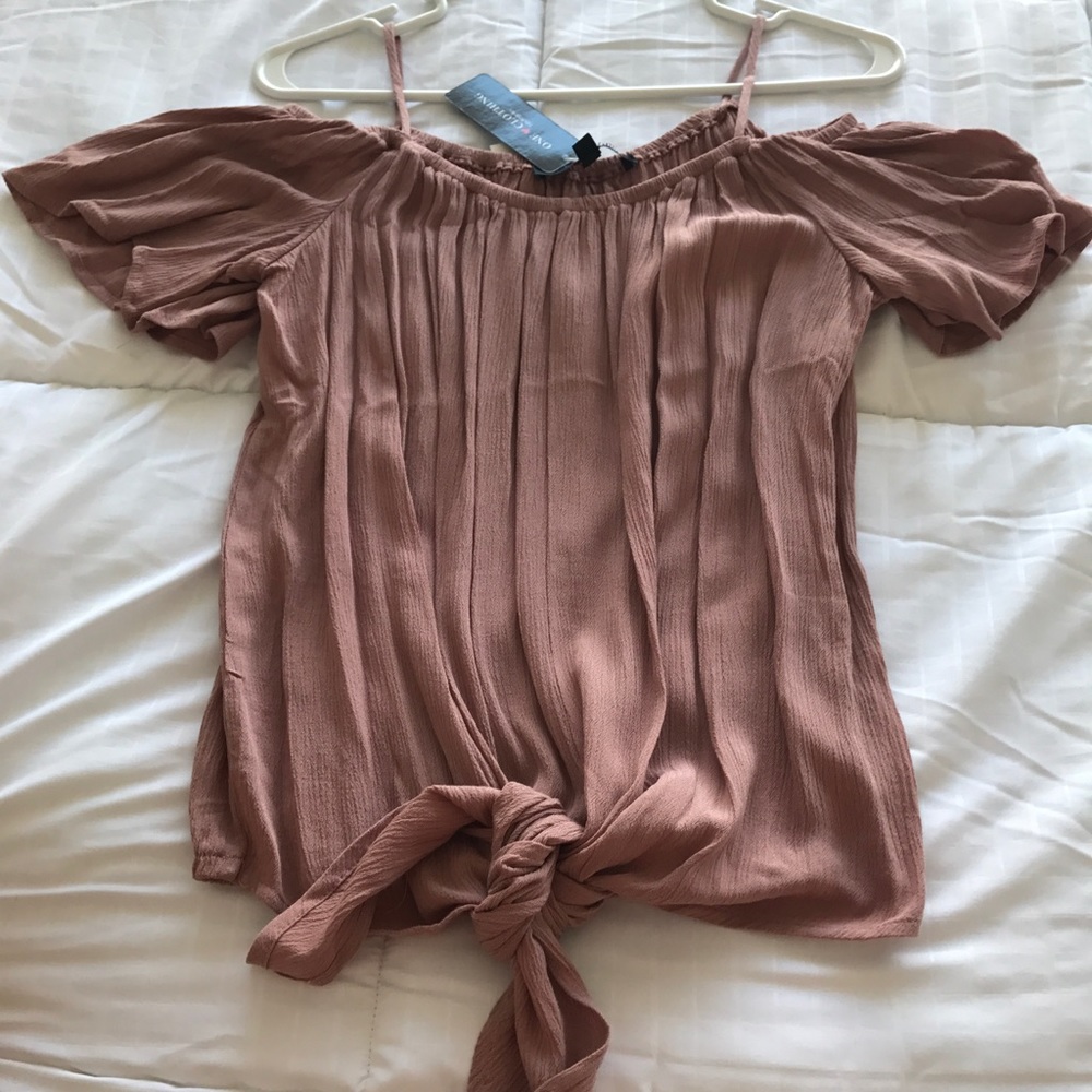 Blush blouse. Tie at the bottom.