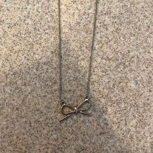 short gold bow necklace