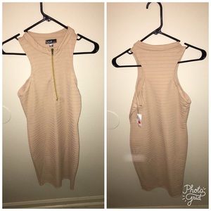Nude, fitted dress with zipper on front