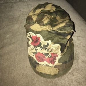 Camo hat with rose appliqué design
