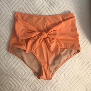 Kortni Jeane high waisted coral bottom.