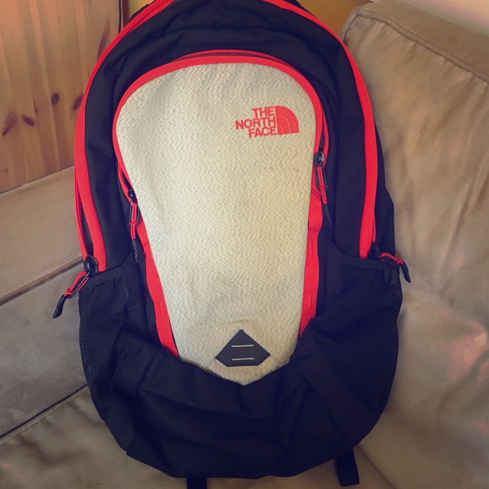Red and black north face backpack