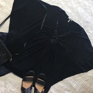 Flirty batwing blouse with beaded neckline