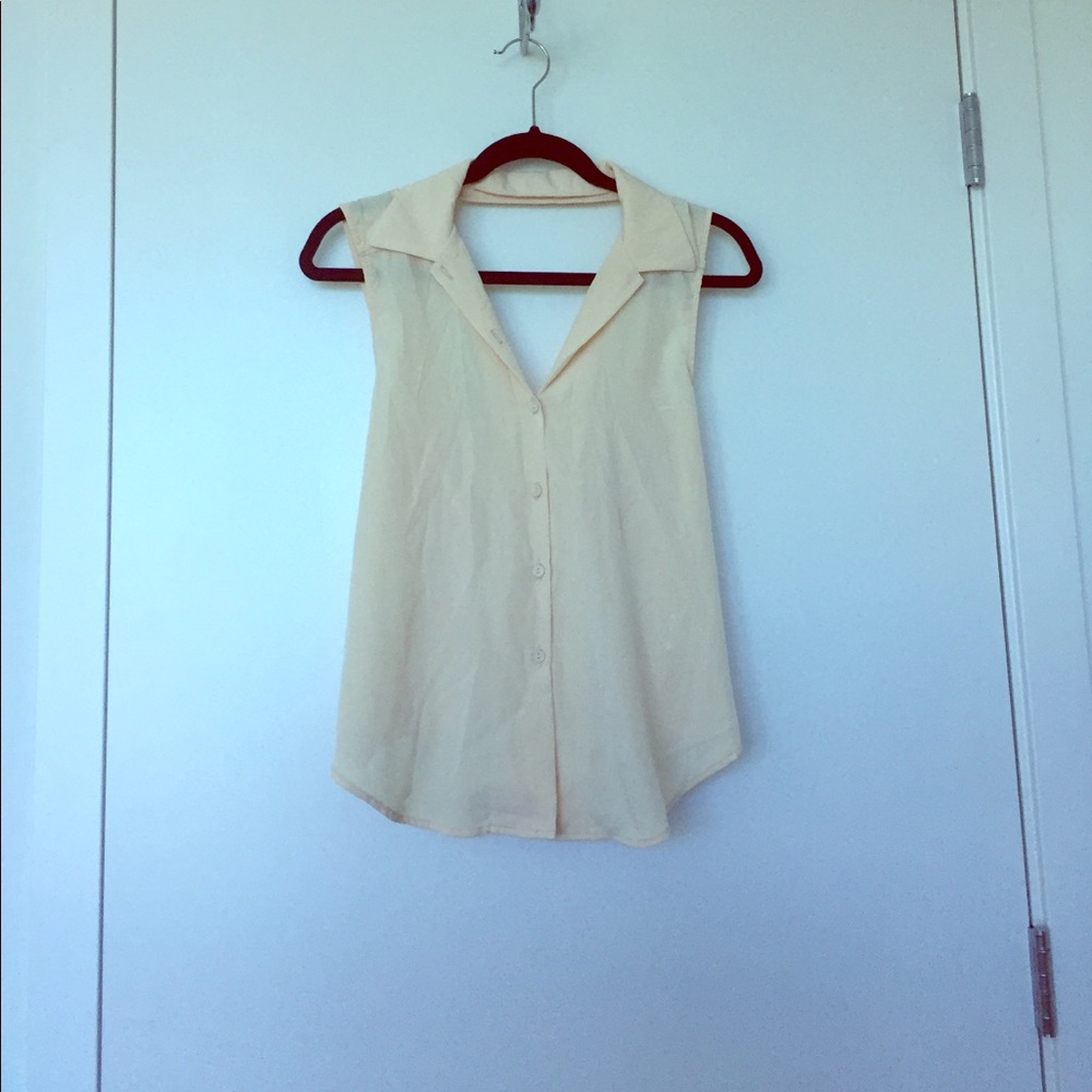 Lush Cream colored blouse. Cute cross back.