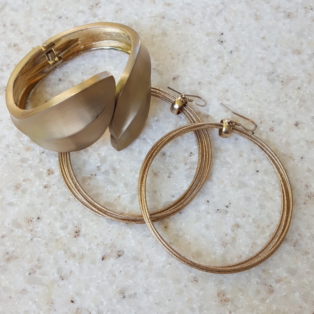 Gold tone earrings and clamper bracelet