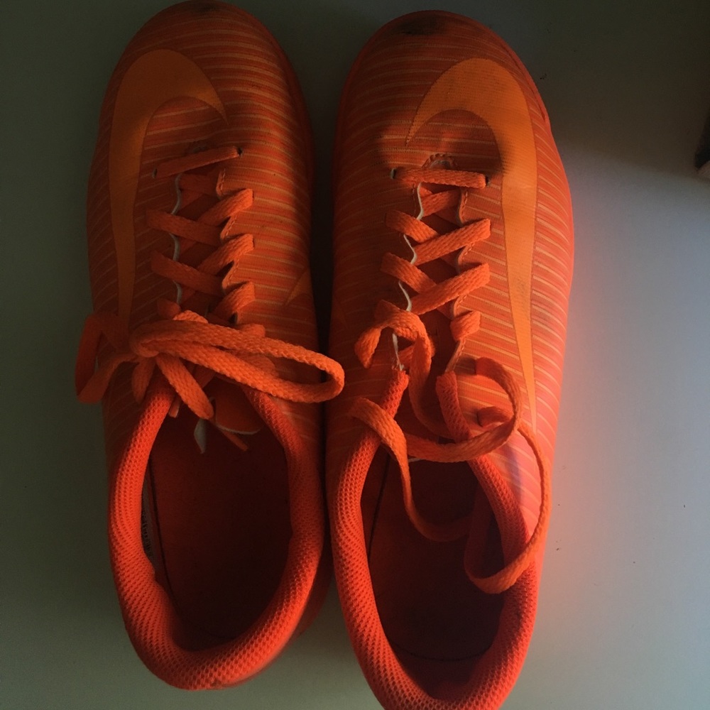 Orange nike soccer shoes